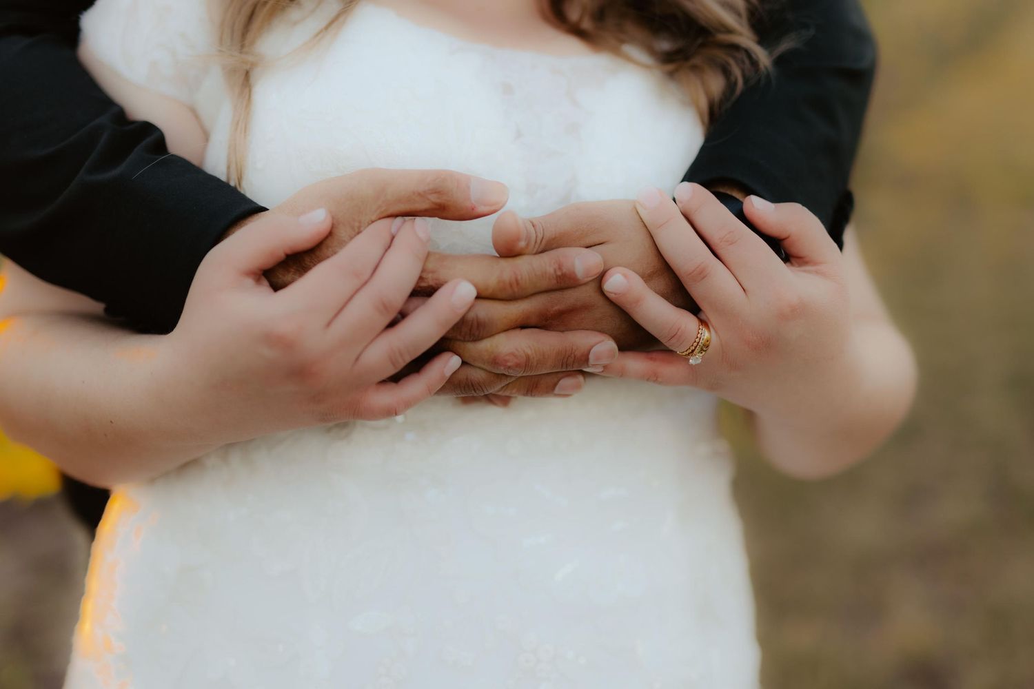 Bride and groom at Capitol View Winery wedding, embracing at sunset with a golden vineyard backdrop, capturing a romantic moment