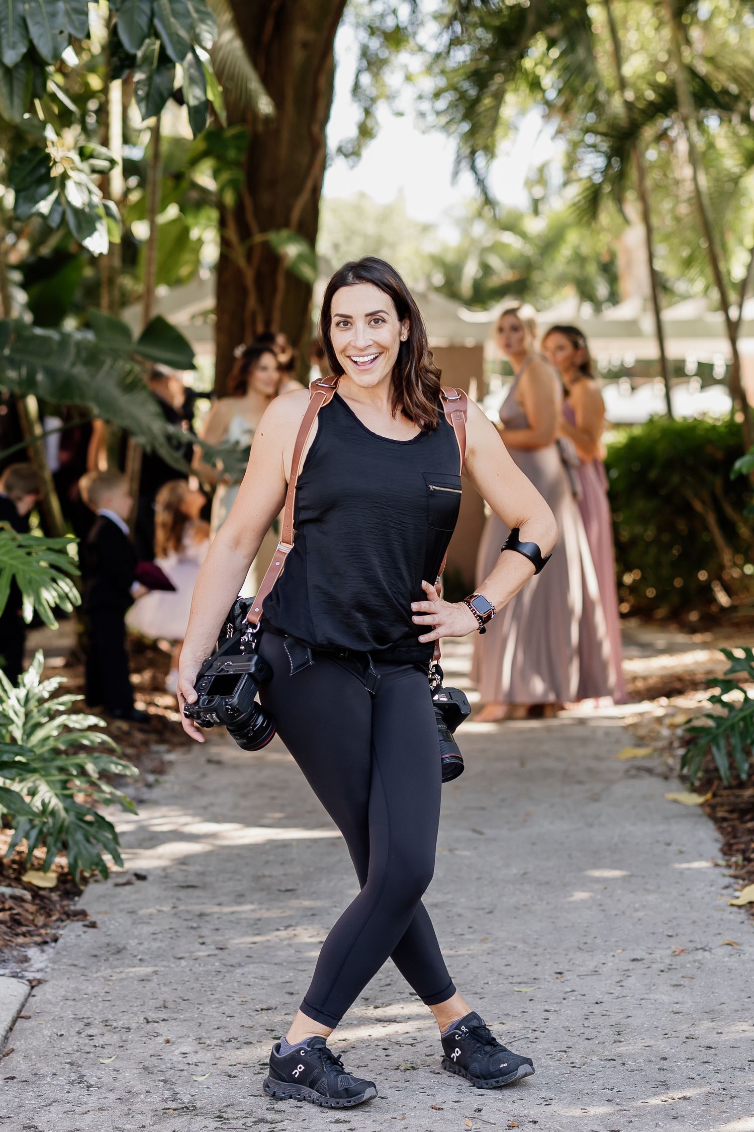 Katelyn Prisco smiling outside the Vinoy Hotel in St. Petersburg, Florida while photographing a wedding.