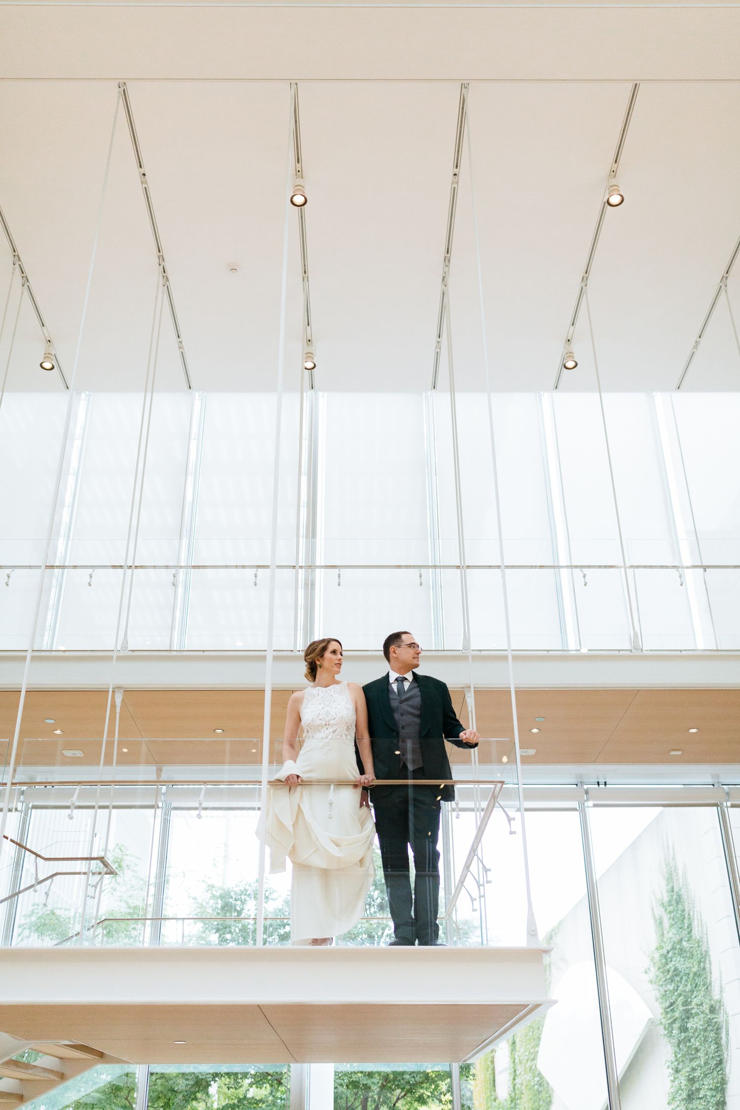 fancy bride and groom stand together at the art institute museum in Chicago