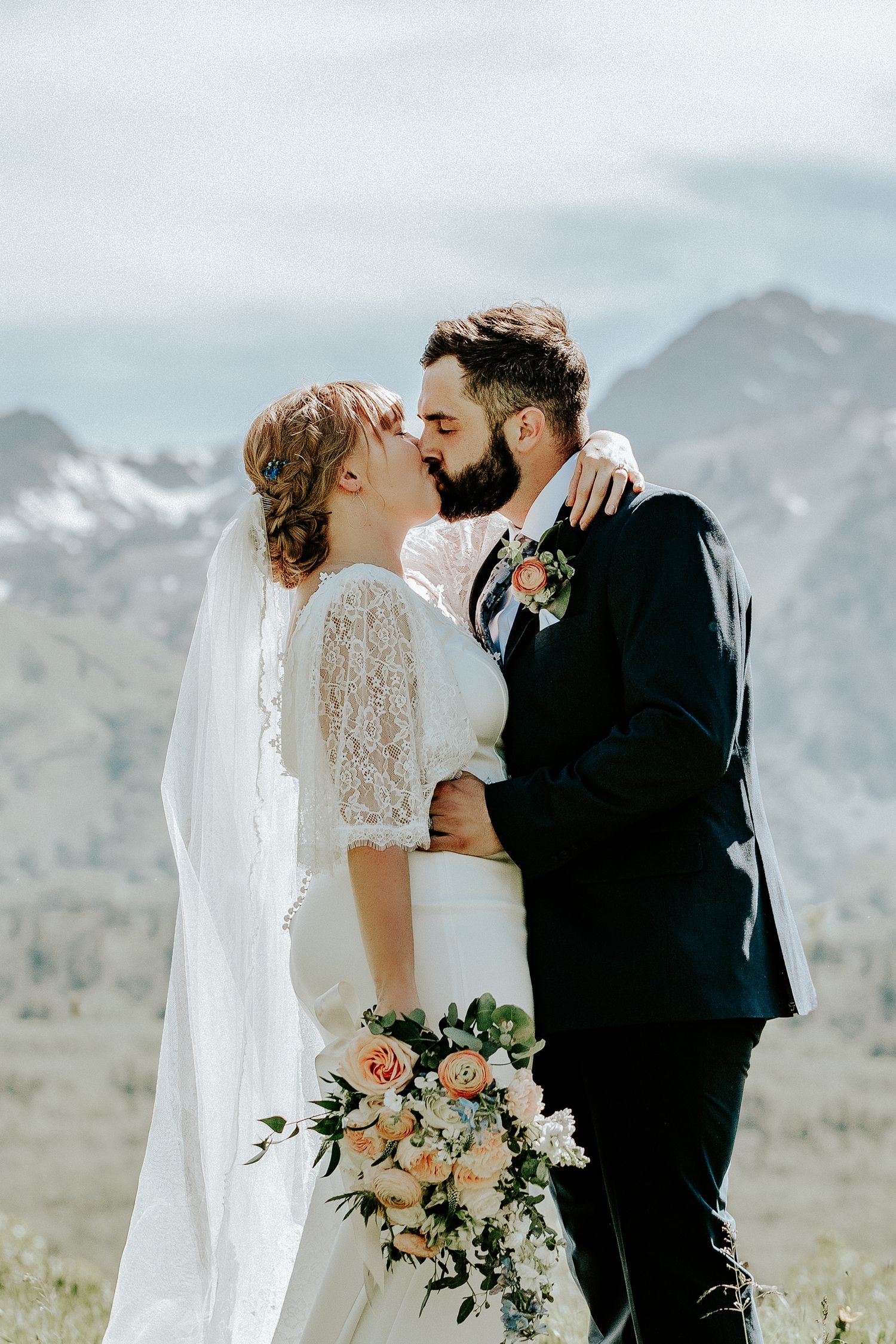 red head bride and brunette groom kiss at their salt lake city elopement