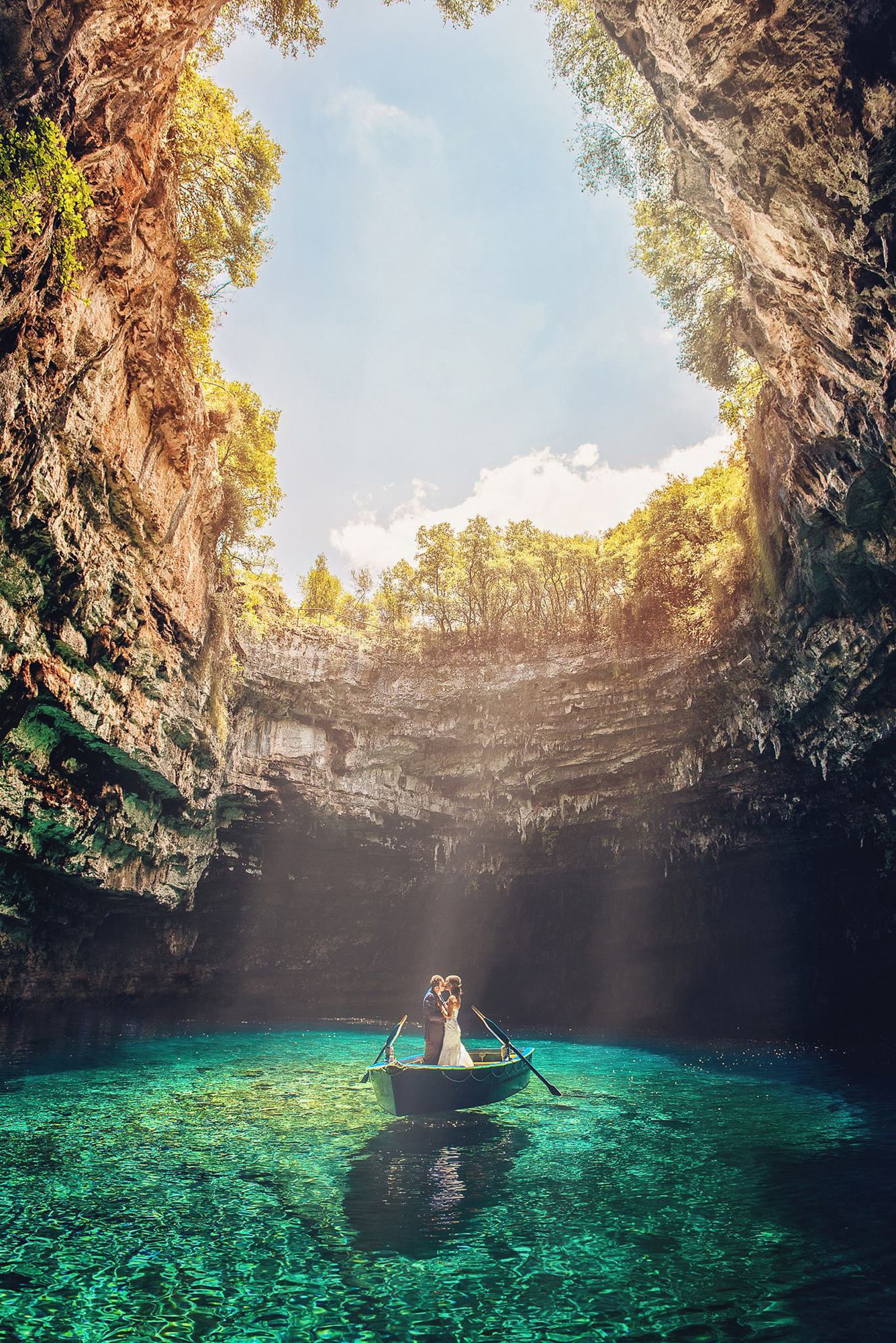 Stunning cenote in Mexico with turquoise water and natural light streaming through the cave opening.