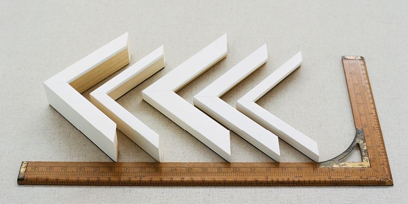 Full shot of the Satin White frame samples, positioned next to a measuring stick for scale.