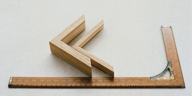 Close-up detail shot of the Miltwood frame, focusing on its smooth finish and refined craftsmanship.