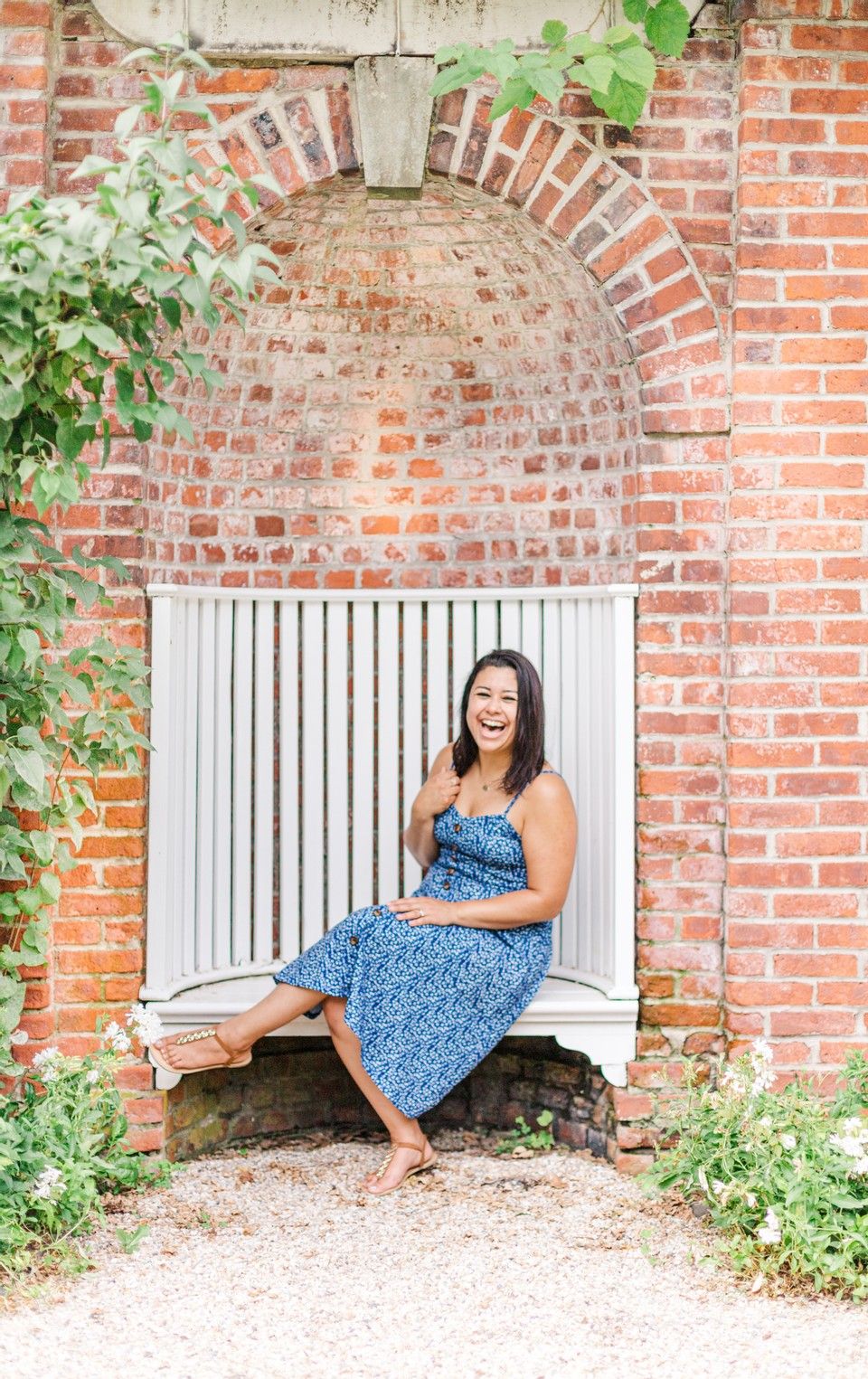 Woman laughing and smiling in a blue dress during a branding session in Red Hook, NY
