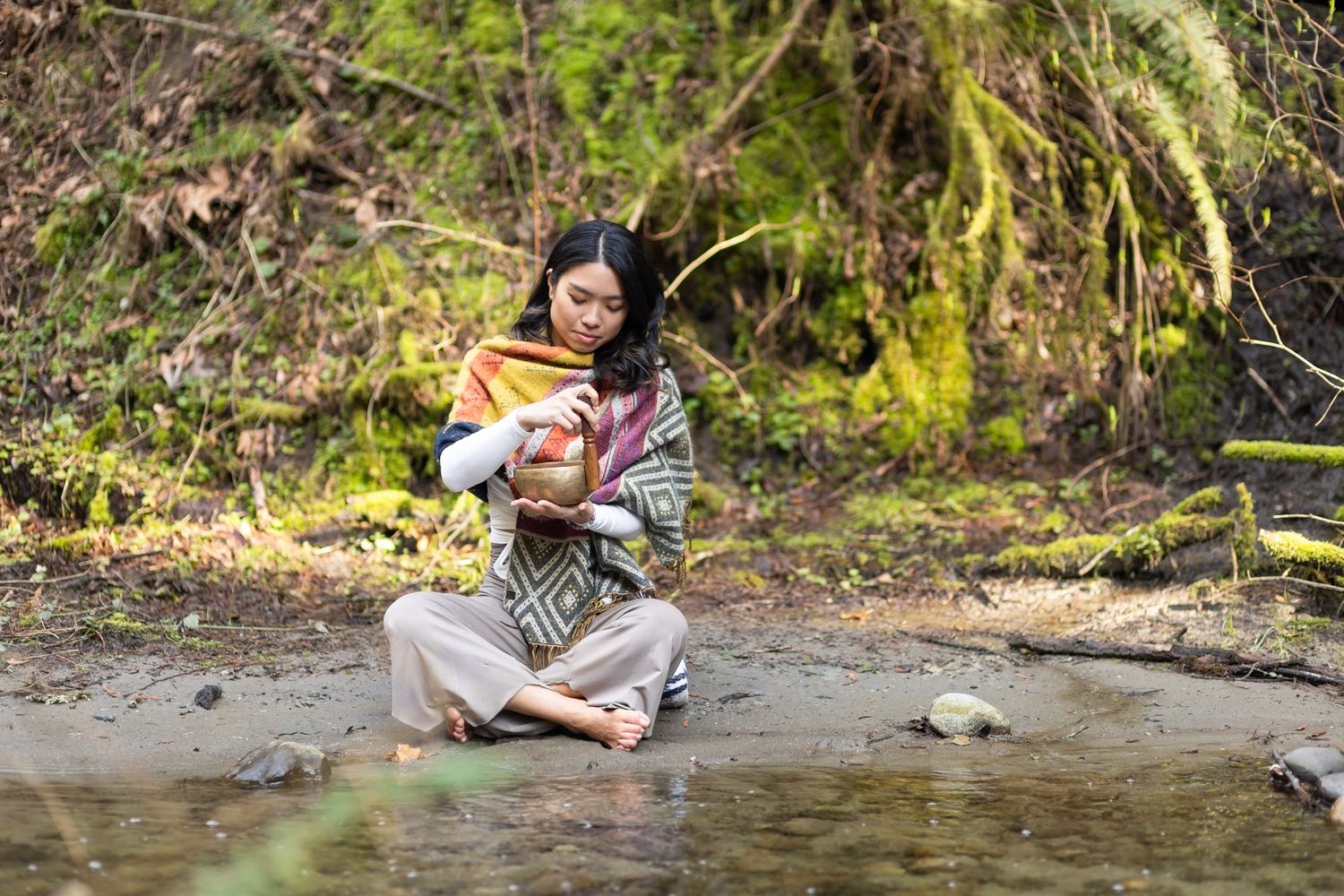 yoga instructor personal branding photos in Kirkland, WA spiritual mediation playing sound bowl sitting by little pond i