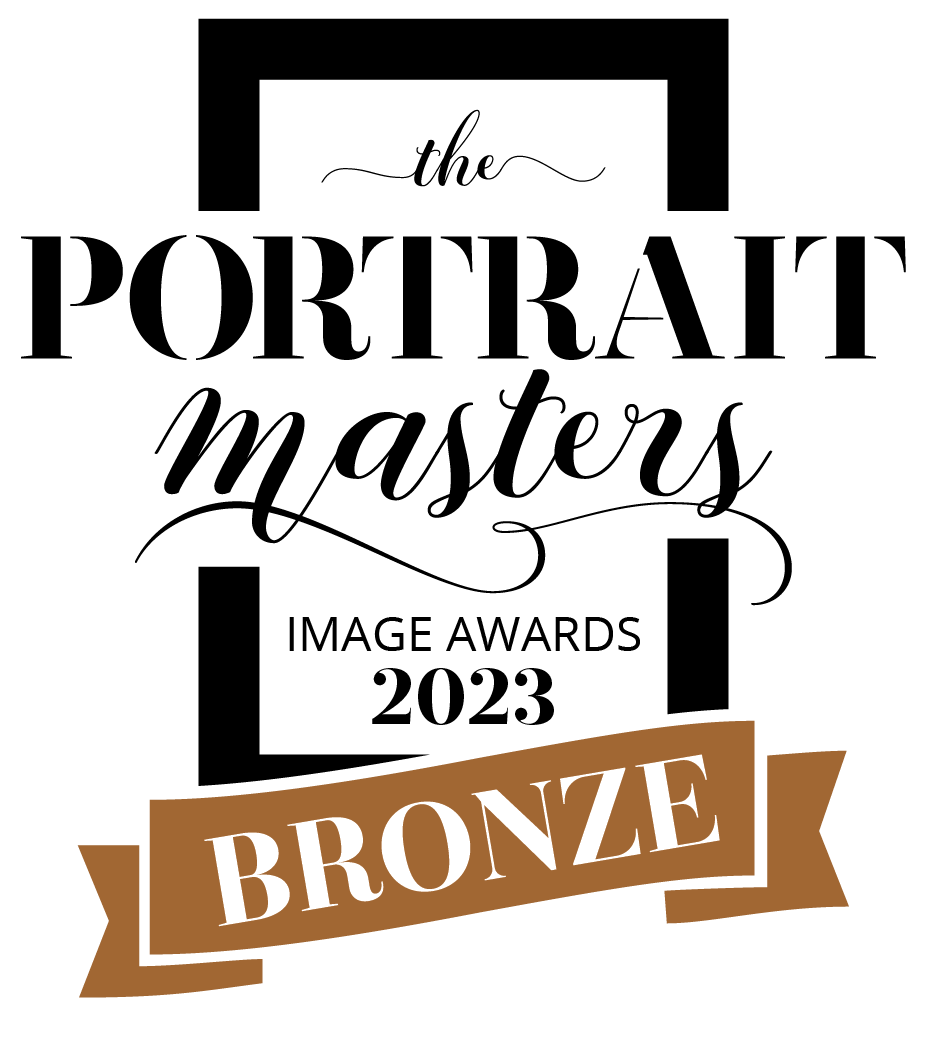 The Portrait Masters 2023 Bronze Award badge for excellence in portrait photography.