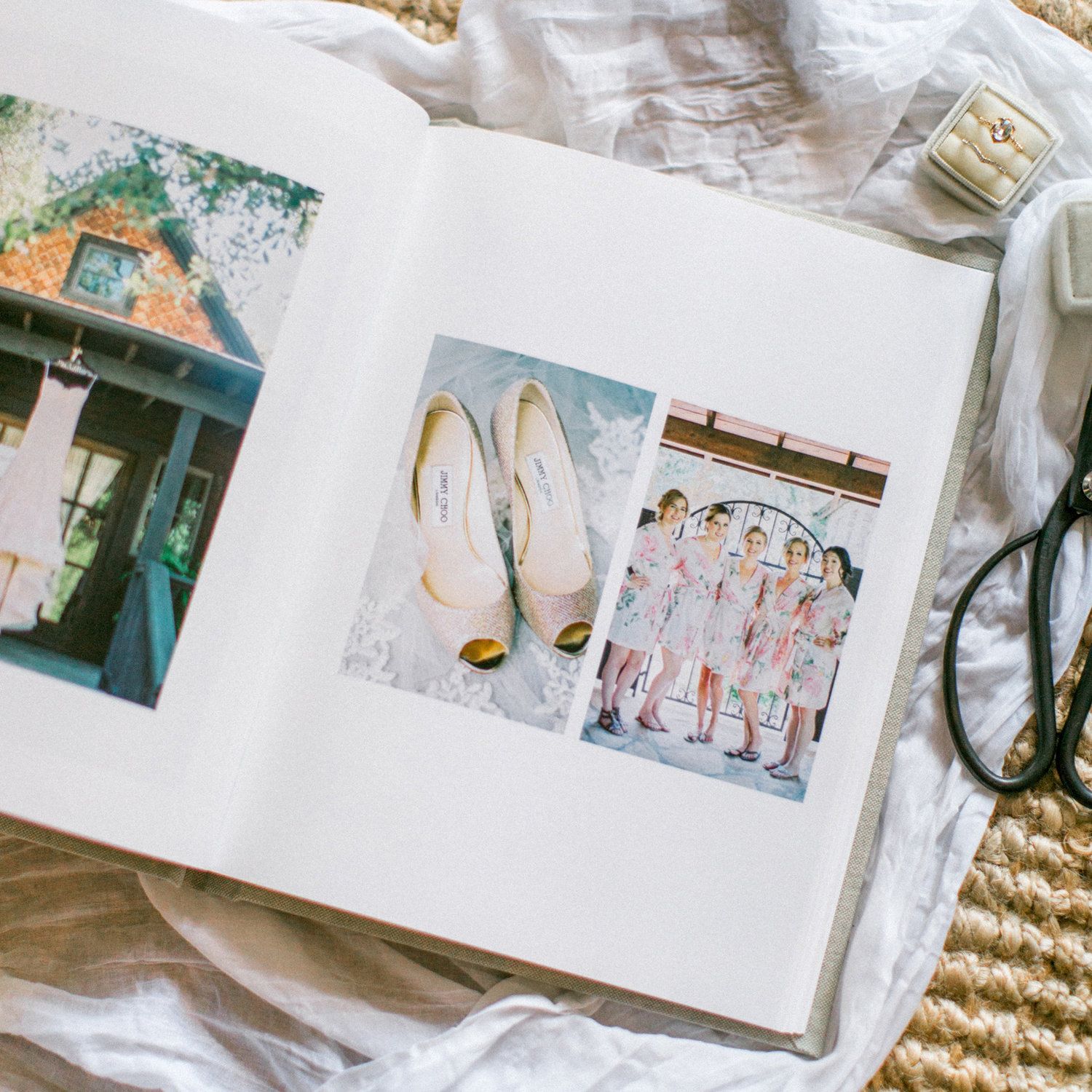 Wedding photo album displaying bridal shoes and group photos on white pages with vintage styling.