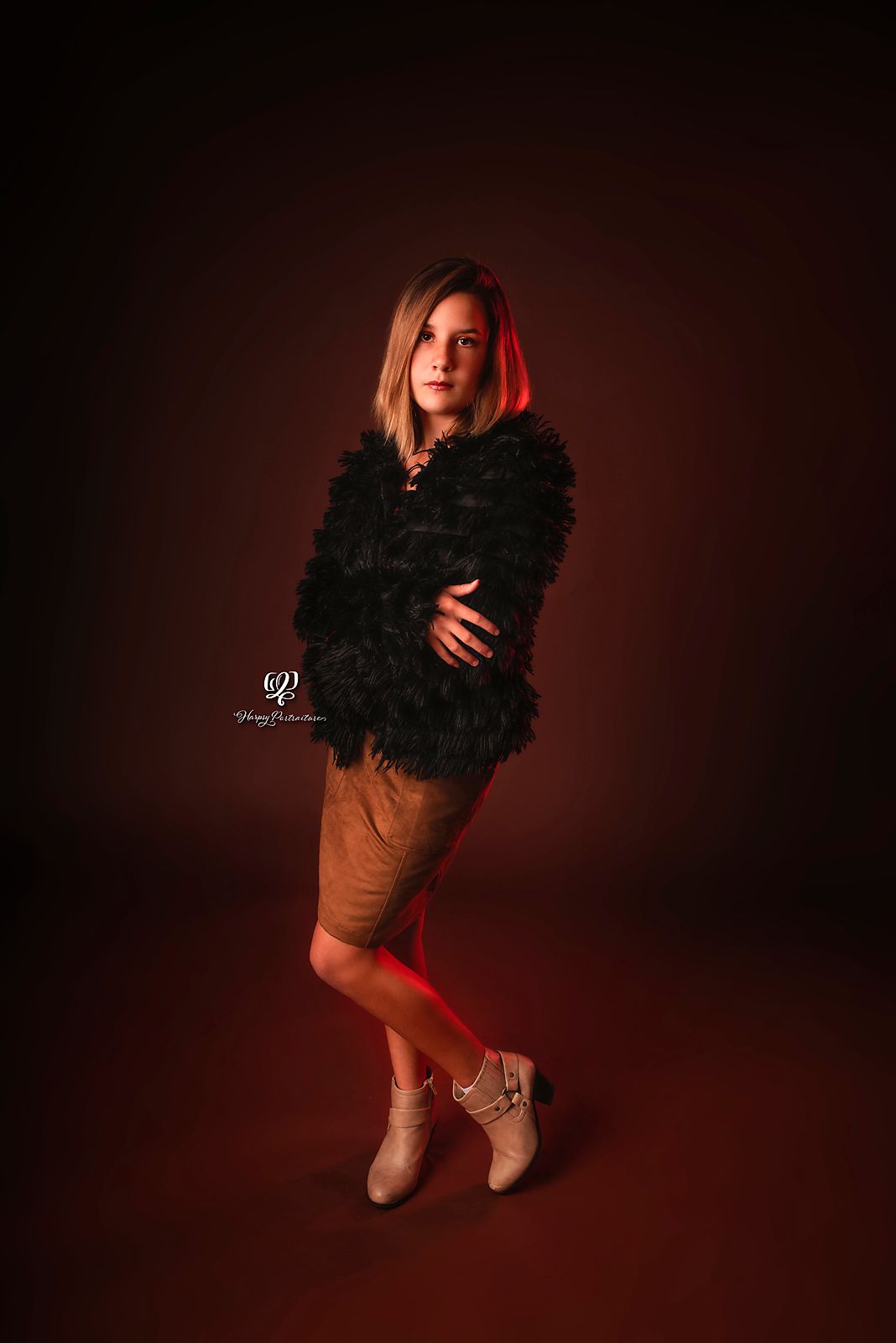 Teen girl wearing furry black coat poses for teen photoshoot studio photography Lexington, SC; indoor photographer South
