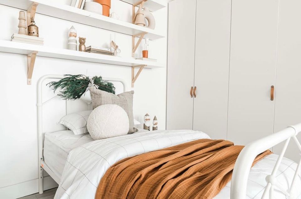 The Nook Burlington Photo Studio Modern Design Space with bed and open shelving.