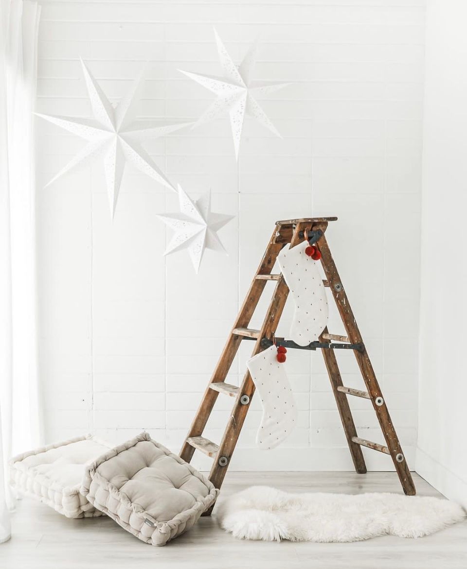 The Nook Burlington Photo Studio Modern Design Space with wood ladder and white hanging stars.