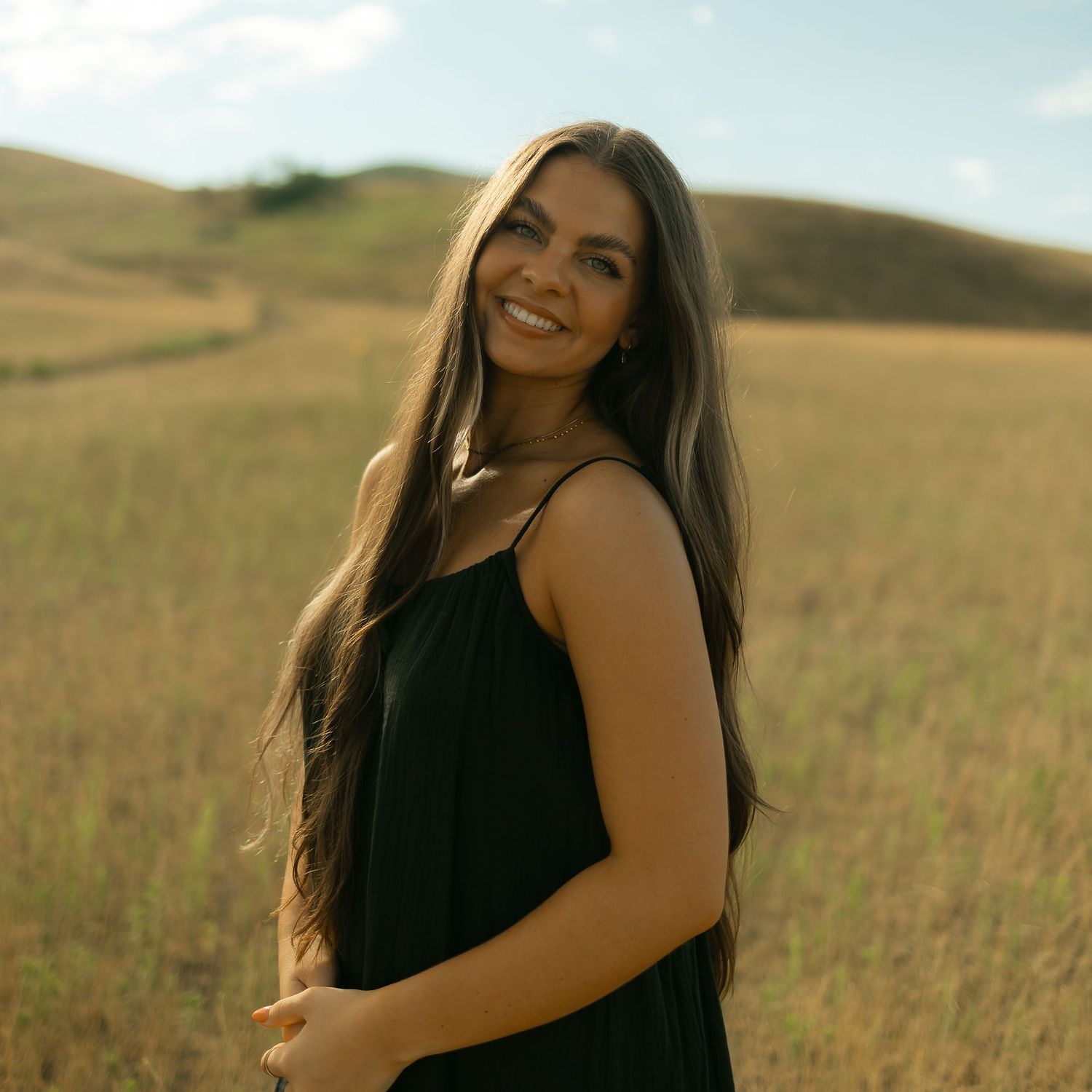 Lyss K. Photography smiling at the camera