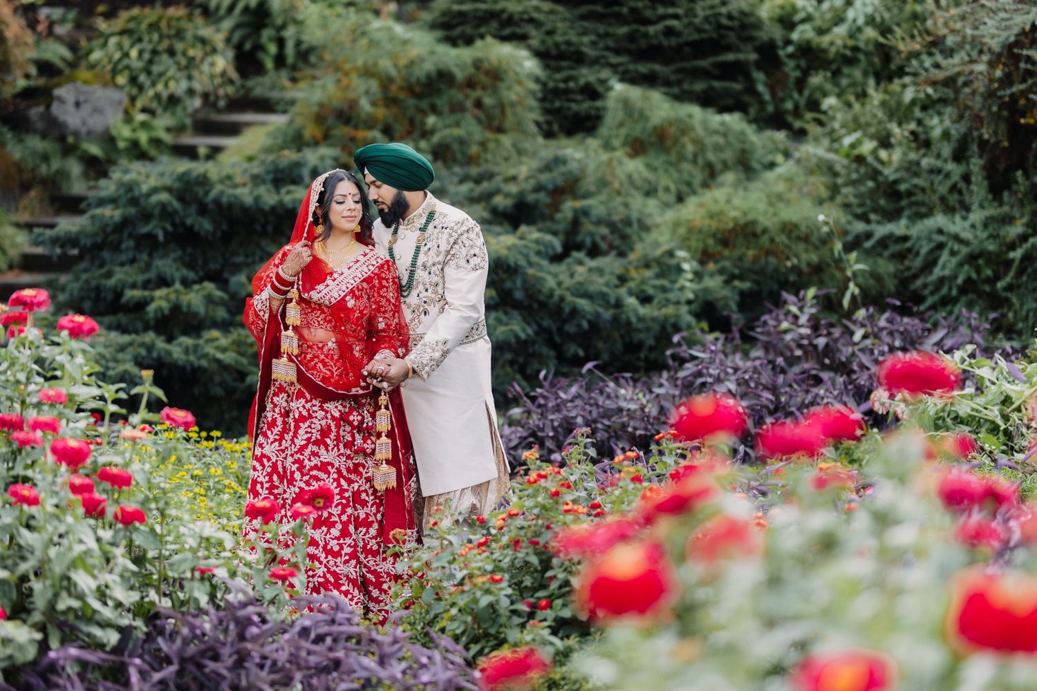 A tender moment as the couple shares a loving gaze, full of joy and anticipation on their wedding day.