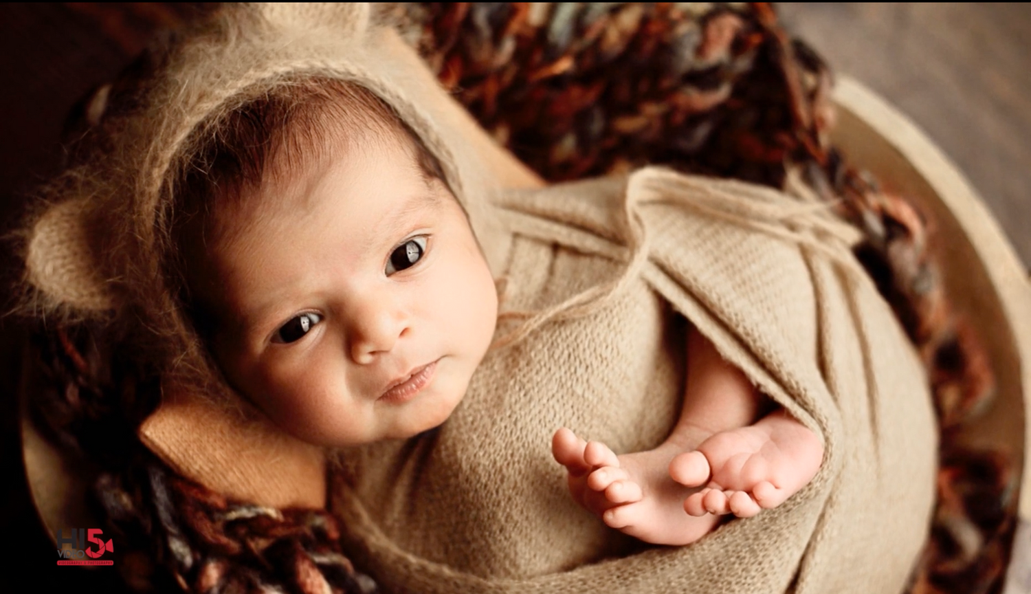 A precious moment capturing the innocence and pure joy of a beautiful baby.