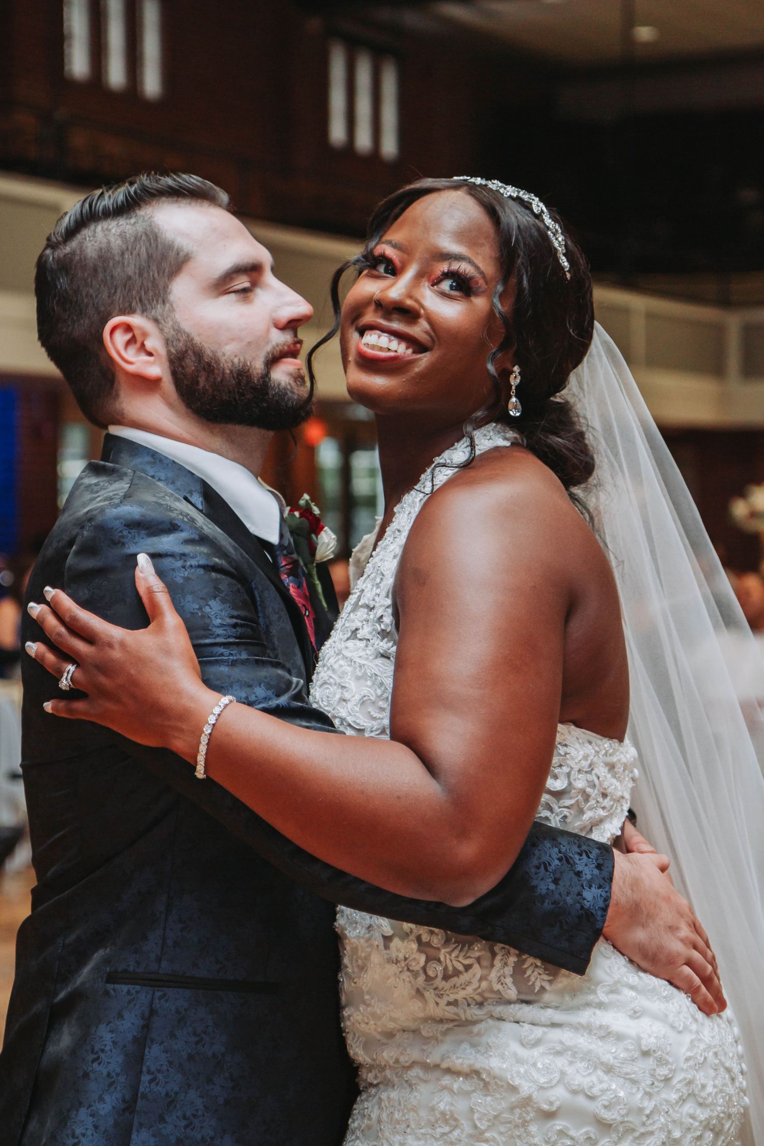 Newlyweds share an intimate dance moment at their wedding reception.