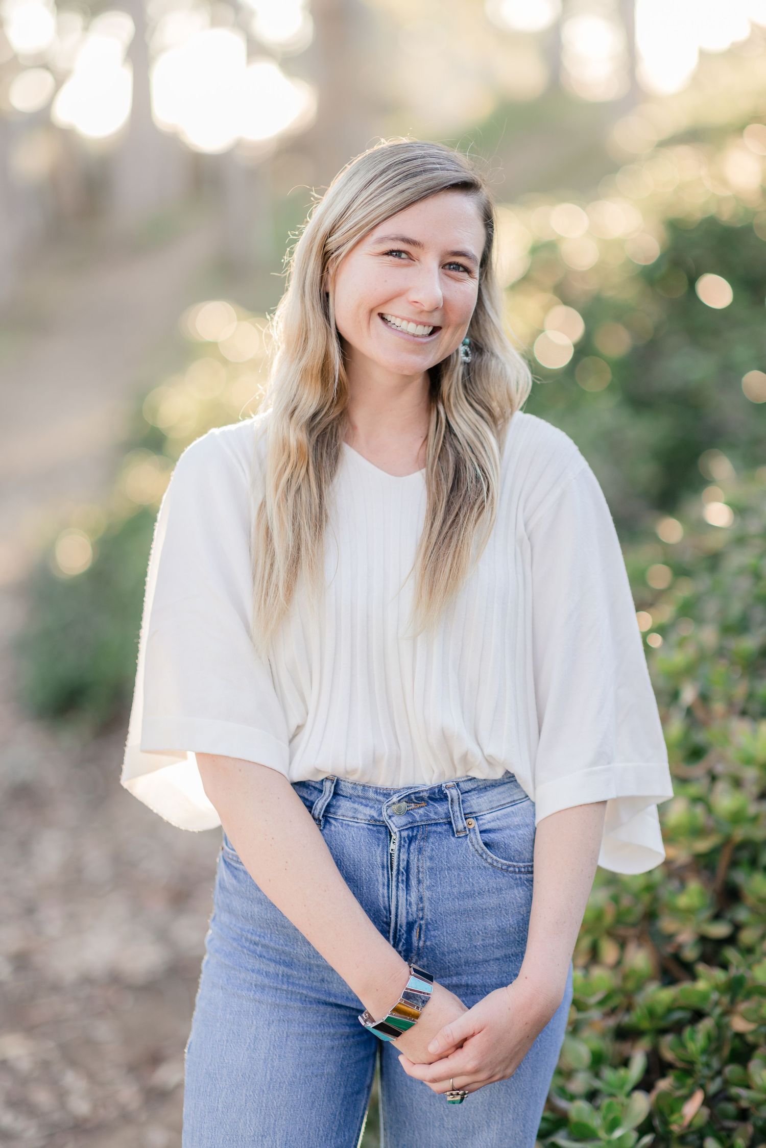 Casual outdoor portraits with natural lighting showing someone in denim and white clothing.