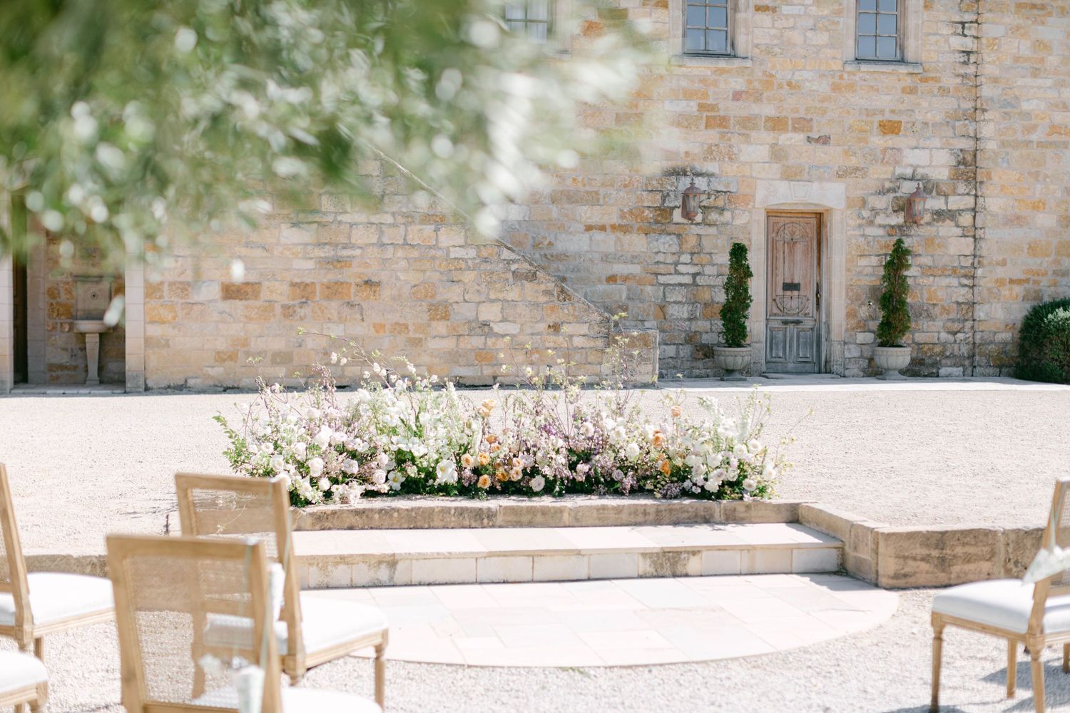 Stone building exterior with rustic architectural details and windows.