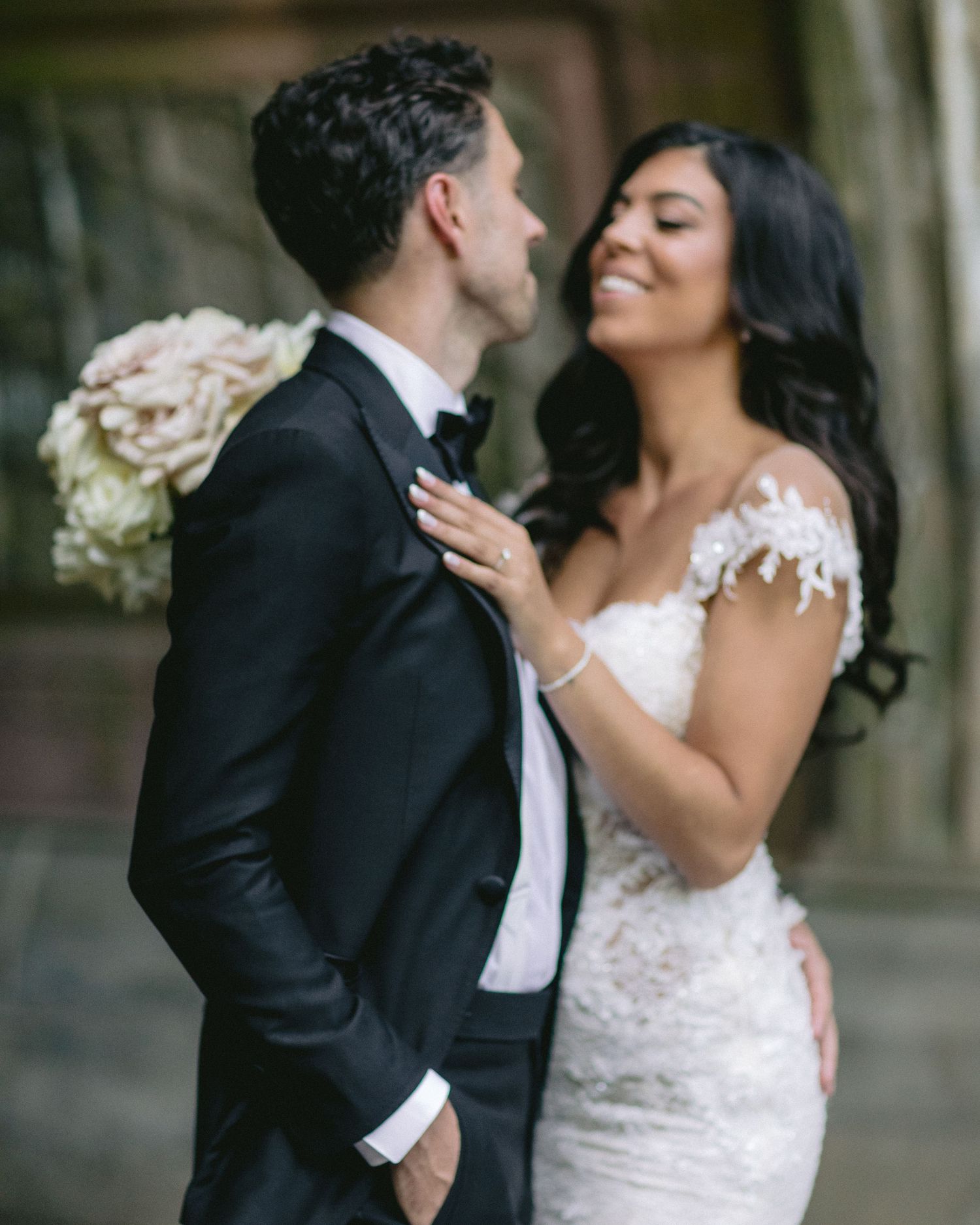 Intimate moment captured between newlyweds during wedding celebration.