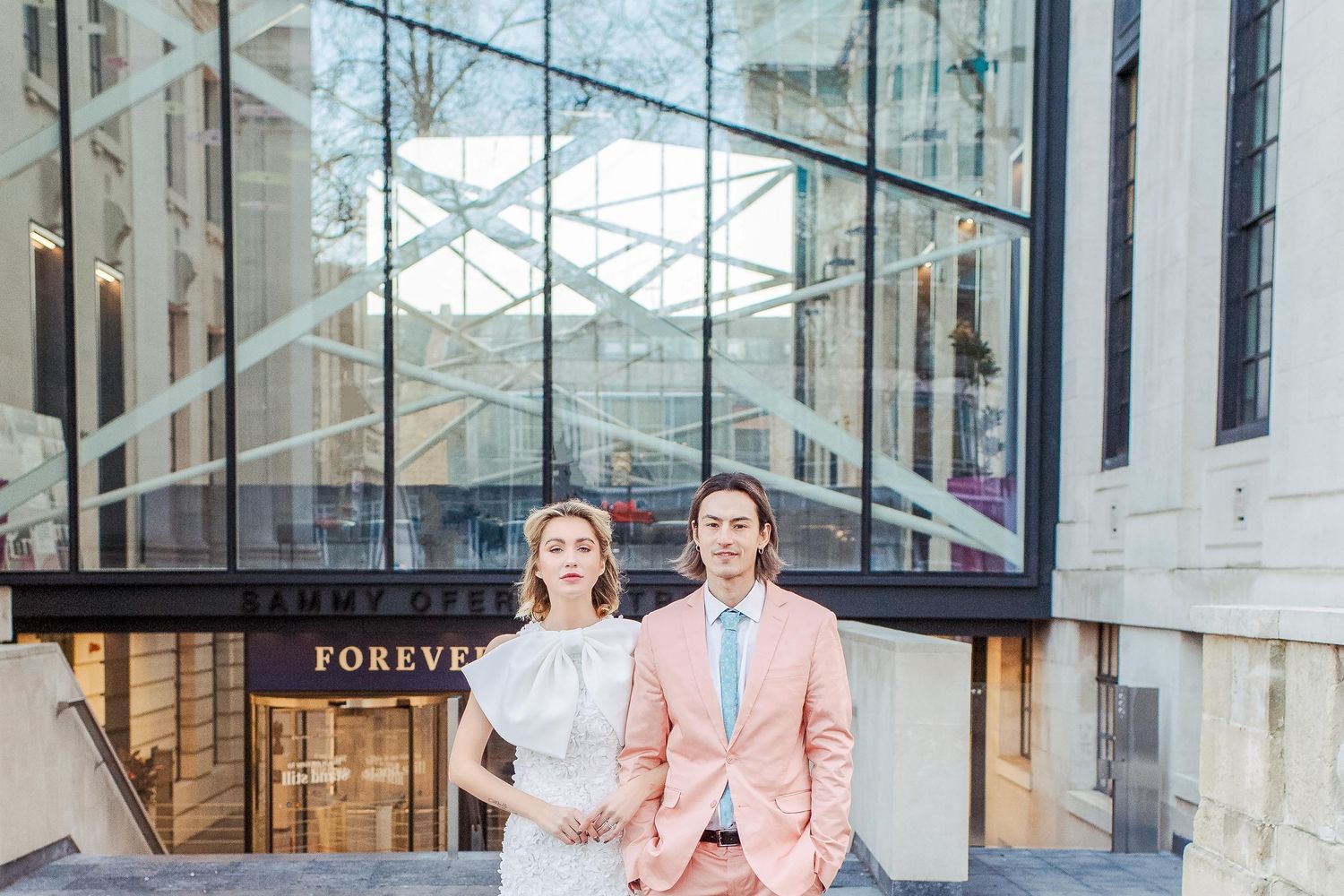 Bride and groom pose together after their London wedding