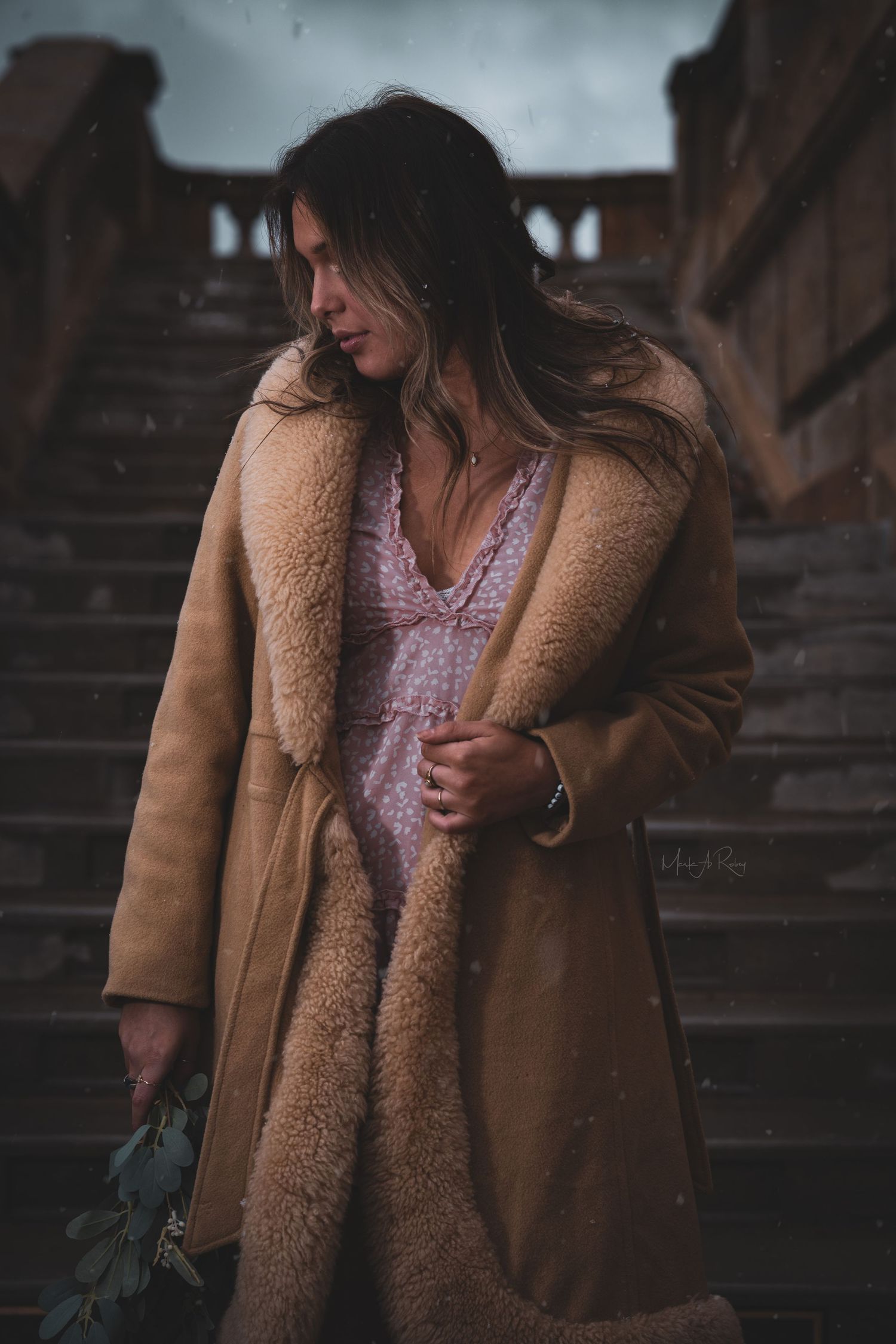 Artistic portrait series featuring a person in a cozy brown winter coat on wooden steps.