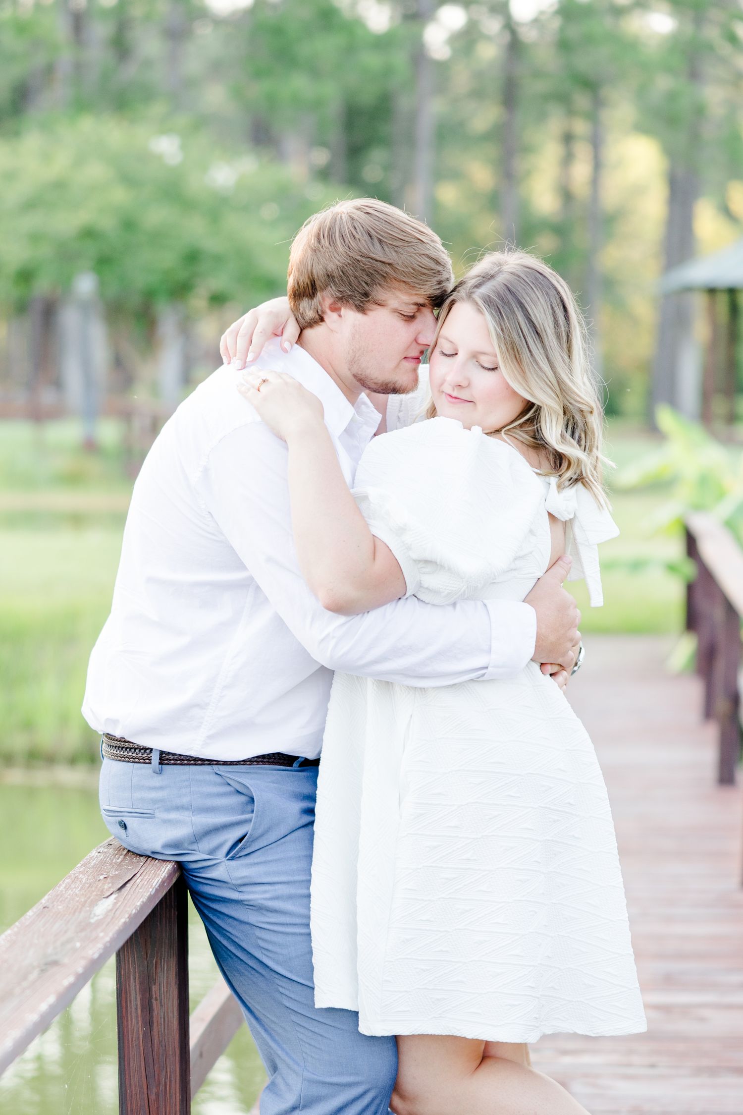 Series of intimate moments between a couple on a wooden boardwalk with pine trees in background.
