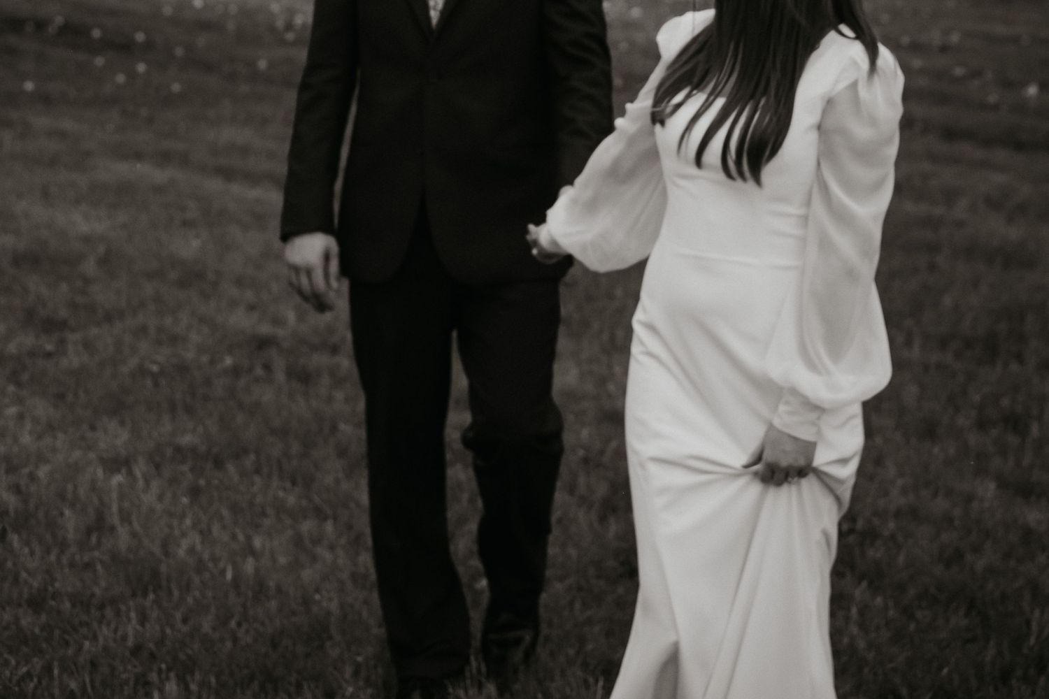 Couple sharing intimate moment during outdoor wedding ceremony.