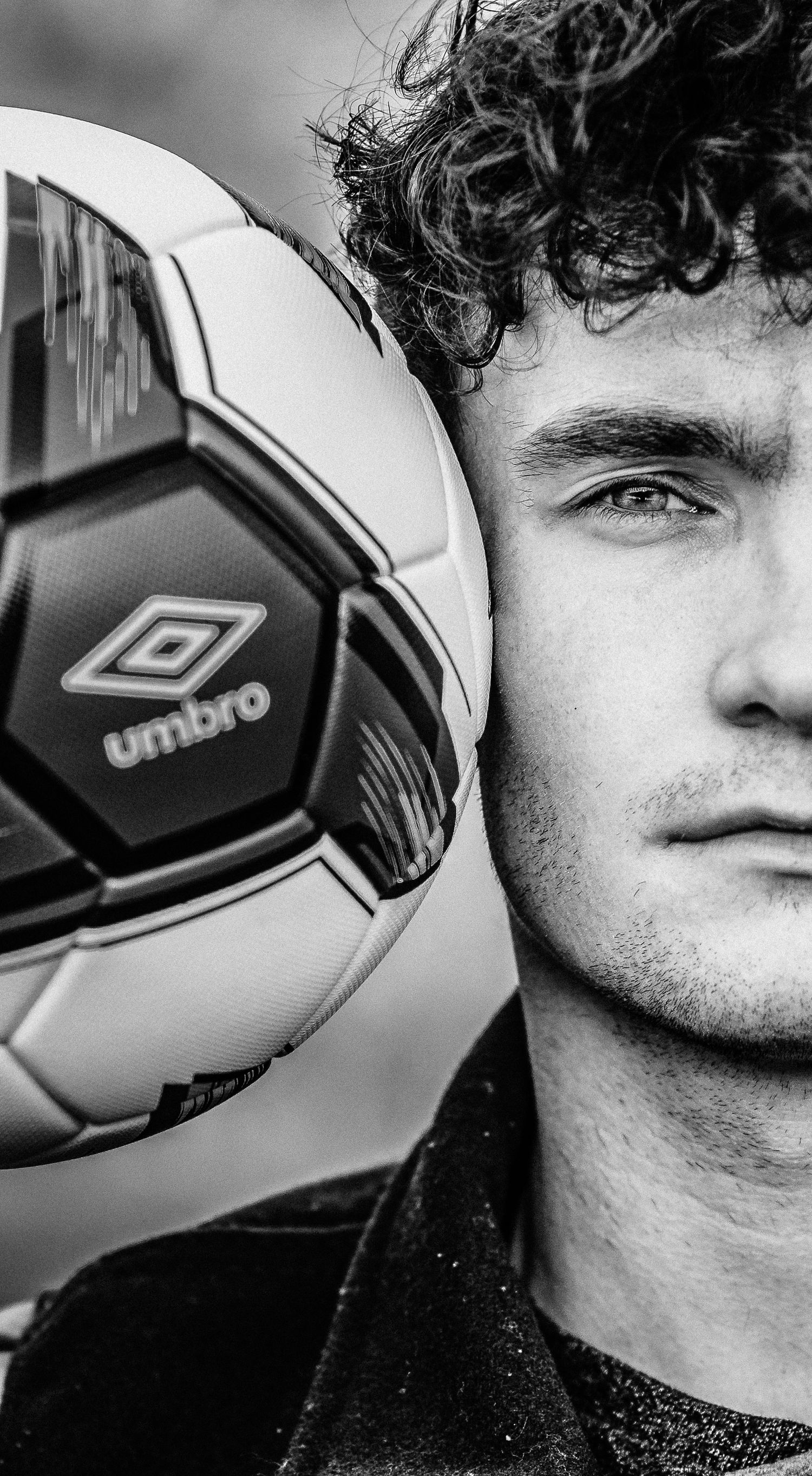high school senior male poses with a soccer ball | west virginia senior photographer | weston, wv